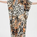 Leopard-print beach robe for a retro, bohemian vibe beach robe for versatile beachwear